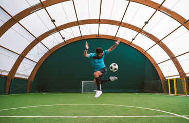 Cinematic image of a soccer freestyle player making tricks with the ball.