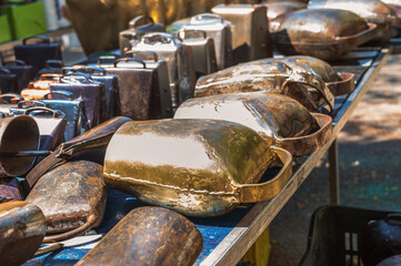 close-up of a cow bells market stall inside the Padula open market, Salerno province