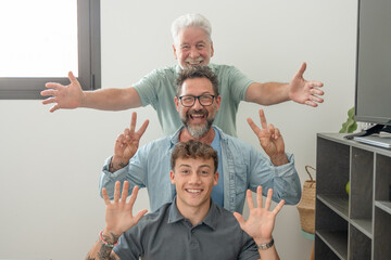 Happy multigenerational family of males stay together posing on scale for memory gesturing positive...