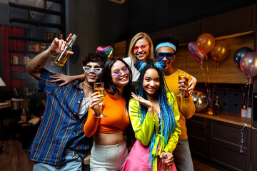 Group of friends making party at home on new year evening