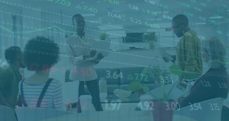 Image of financial data over diverse coworkers in office