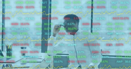 Obraz premium Image of financial graphs and data over african american man in office