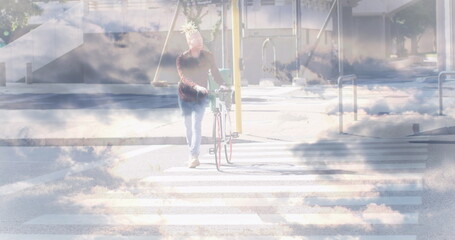Image of clouds over albino african american businessman walking
