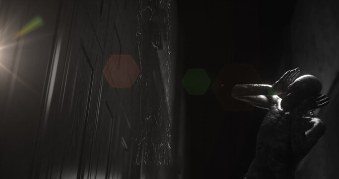 Image of black and white scratched film of scary figure in dark corridor holding head in pain