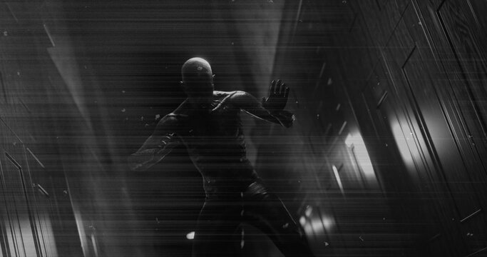 Image of black and white scratched film of scary figure in dark corridor holding head in pain