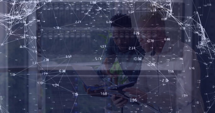 Image of network of connections and icons over two diverse business people