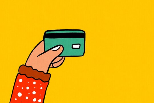 Hand holding credit card on vibrant background