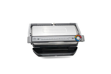 Contact grill closed - control panel visible isolated on white. A modern contact grill in a closed position with a digital control panel and temperature display. The device is isolated on a white back