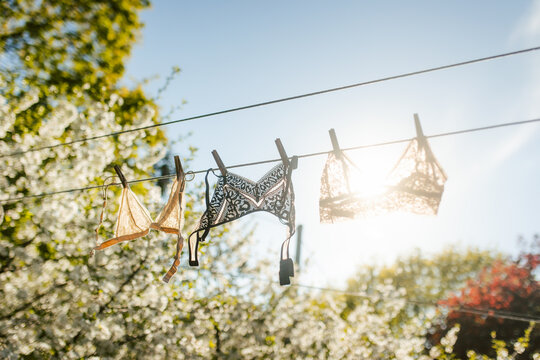 Laundry drying on clothesline under bright sunlight