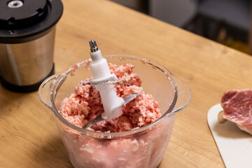 Just ground meat mince in the glass ball of the electrical chopper on the kitchen counter top. Cooking