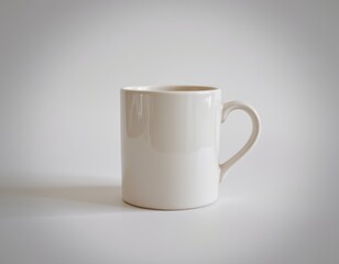 Fototapeta premium Classic white mug on grey background, perfect for mockups and beverage presentations