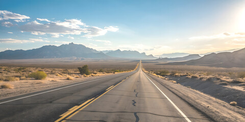 Straight Desert Highway with Mountain View Under Blue Sky