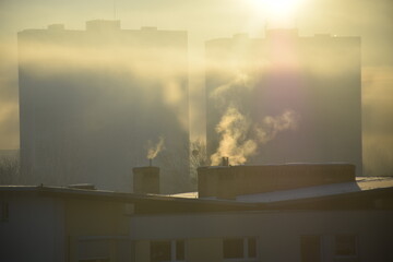 Morning view on dense pollution and smoke from chimneys
