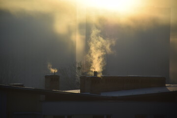 Chimneys polluting city with smoke and smog