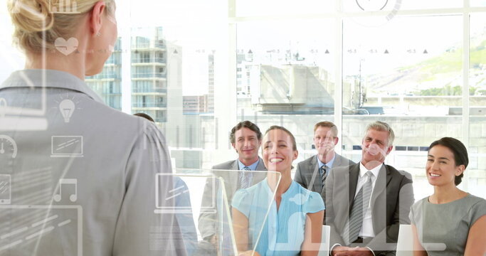 Image of data processing with icons over diverse business people at office - Powered by Adobe