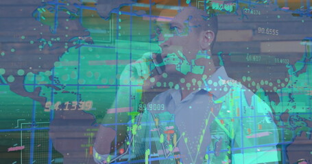 Image of data processing over caucasian businessman talking on smartphone