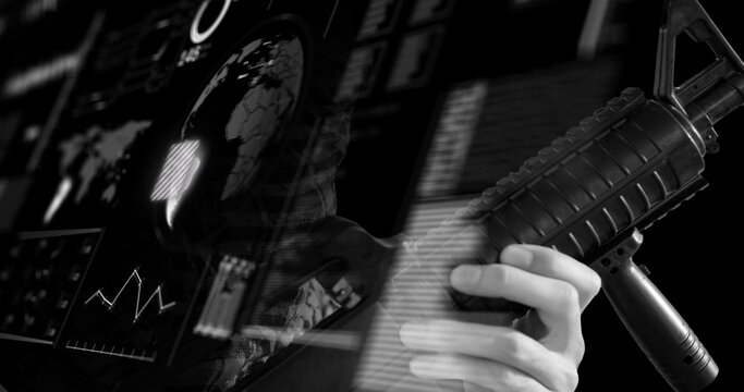 Image of hand of soldier holding gun over globe and data on digital interface, black and white
