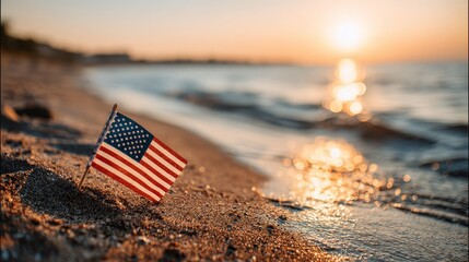 American flag waving on a beach at sunrise celebrating usa flag's national pride on 4th of july in a peaceful landscape