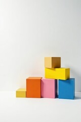 Obraz premium Colorful blocks arranged in a visually appealing ascending order against a clean white background