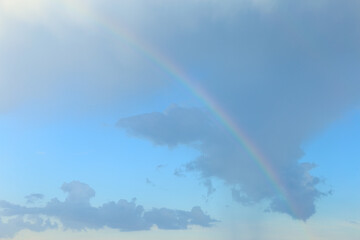 Rainbow in the sky and wonderful shape of rain cloud.