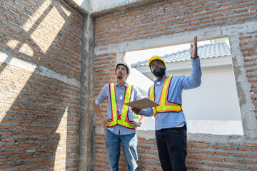 Construction workers collaborating on a building project at a construction site in the daytime