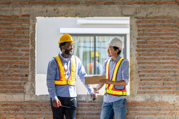 Construction workers collaborating on a building project at a construction site in the daytime