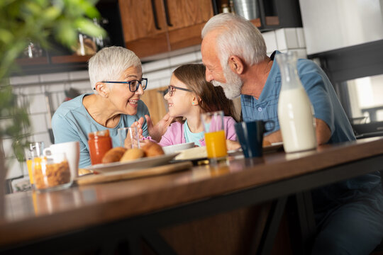 Cute little girl at grandparents on breakfast