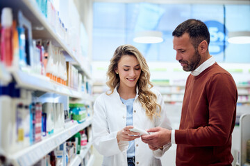 Pharmacist Assisting Customer in Modern Pharmacy with Product Advice and Guidance