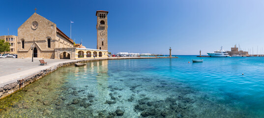 Entrance to Mandraki harbor and marina. Hirsch and Hirschkuh, Elafos and Elafina, bronze statues of deer and stags in the place of the Colossus of Rhodes. Sightseeing in the old town. Rhodes, Greece