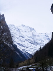 A view of the mountains and the high cliffs. Lauterbrunen, Switzerland - February 12, 2025.