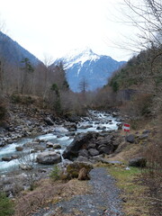 The Lütschine River with the Swiss Alps in the background. Lauterbrunnen, Switzerland - February 12, 2025. 