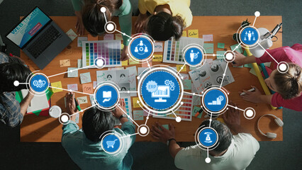 This image showcases a collaborative workspace where a team brainstorms and engages in creative processes, surrounded by color samples and an ERP system diagram. Amity