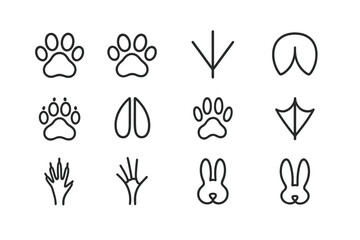 Various animal paw and footprint silhouettes on black background