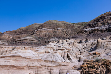 Surreal Badlands Sandstone Formations near Drumheller, Land of hoodoos, multi-hued canyons and geological erosion sculptured by water and wind