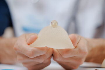 Damage of silicone breast implant in plastic surgery clinic. Problem to chest during operation