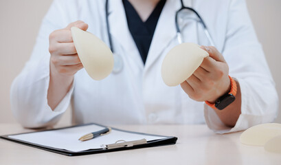 Silicone breast implants in medical clinic setting with professional consultation for woman