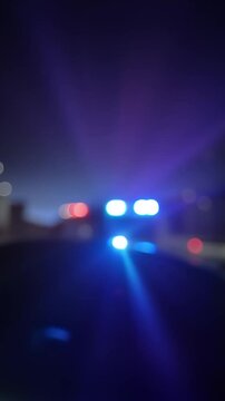 Defocused flashing red and blue lights, concept of police sirens and emergency