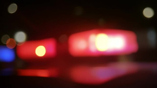 Defocused flashing red and blue lights, concept of police sirens and emergency