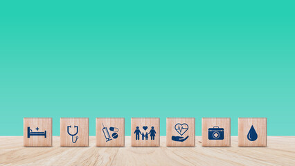 Health Insurance and medical care concept, wooden blocks displaying health related icons, medical...