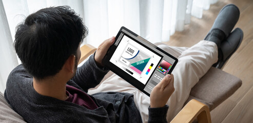 Graphic designer software for modern design of web page and commercial ads showing on the computer screen