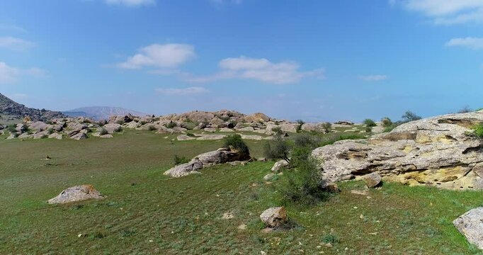 Uninhabited area surrounded by rocks and boulders. Drone shoot of Gobustan, Azerbaijan