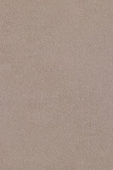 Obraz premium Beige plaster wall. Building wall background texture. Light sand color wall. Texture. Cream plaster with sand texture. Beige textured background. Grainy background