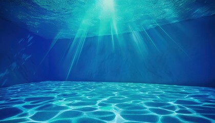 underwater sunlight beams illuminating tranquil blue ocean floor with rippled reflections for web design, meditation theme, nature branding, or background in wellness and aquatic projects

