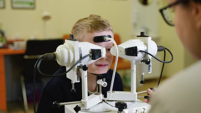Young boy undergoing amblyopia treatment with synoptophore