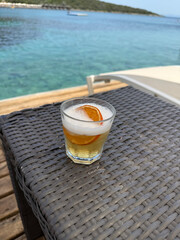 Whiskey Sour  A tart cocktail with whiskey, ice, cherry, and orange