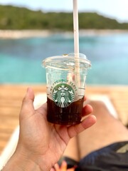 CONDADO, PUERTO RICO - JANUARY 24, 2017: A Starbucks coffee on the beach in Condado, Puerto Rico.