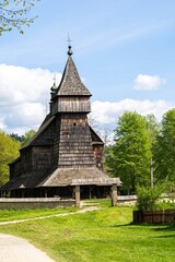 External view of the beautiful wooden church in the open air museum in Sanok in the Bieszczady Mountains in Poland