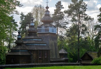 A beautiful wooden church with three towers from the open-air museum in Sanok.