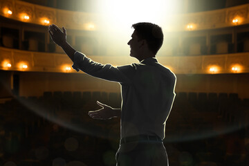 Man performing on stage in concert hall