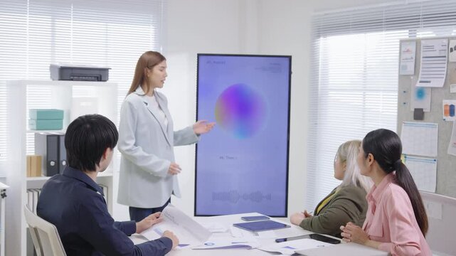 A strategic business team gathers in a modern office for a collaborative brainstorming meeting, supported by an AI-assisted display screen system that helps present innovative ideas and smart solution - Powered by Adobe